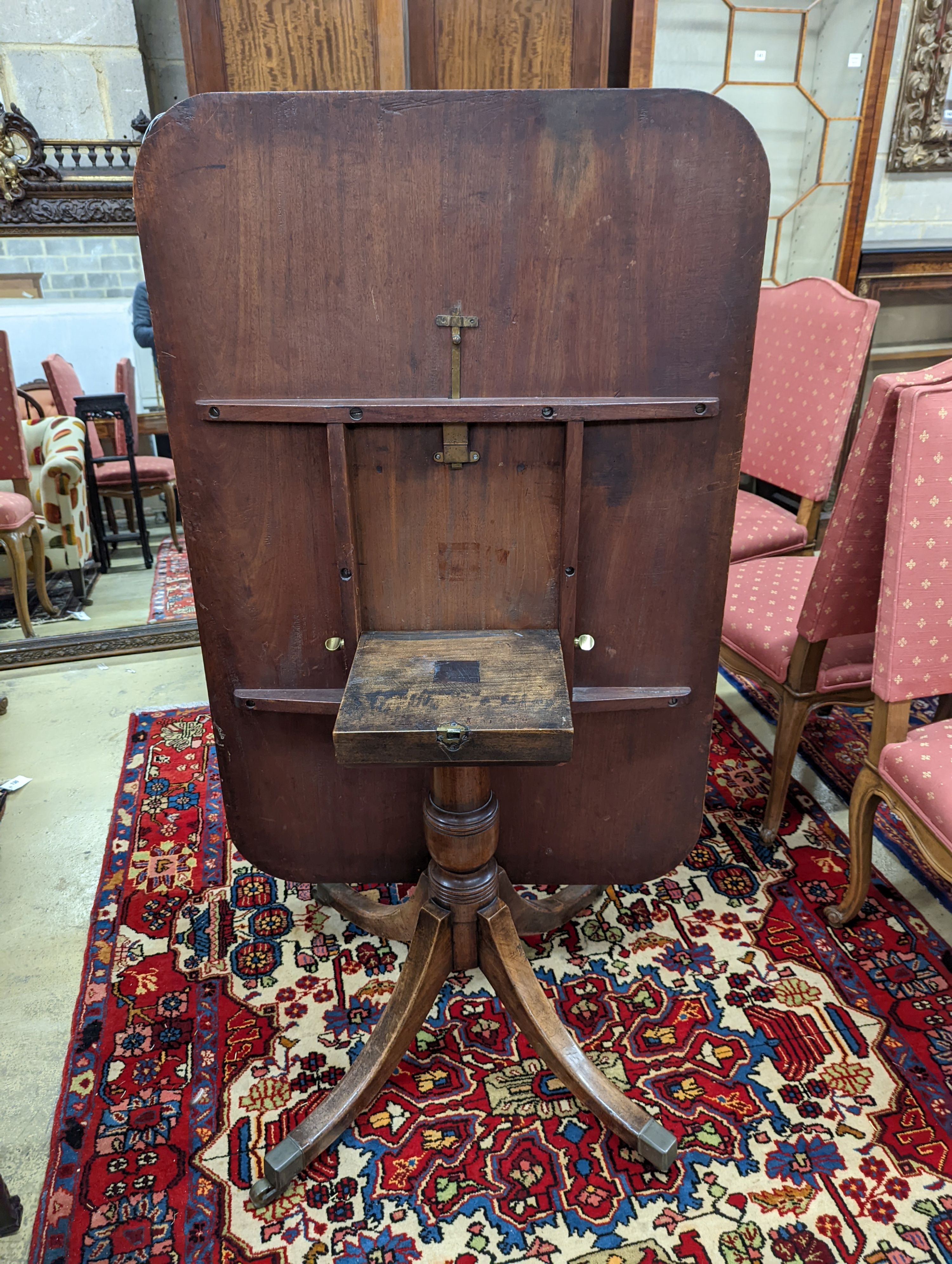 A Regency banded mahogany rectangular tilt top dining table, length 121cm, depth 82cm, height 71cm